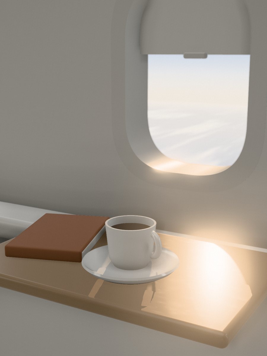 A window seat in the morning: coffee and a book on the tray table, sun across it